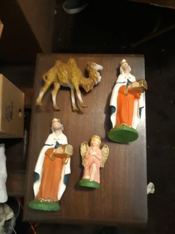 Nativity figurines including a camel, an angel, and a wise man